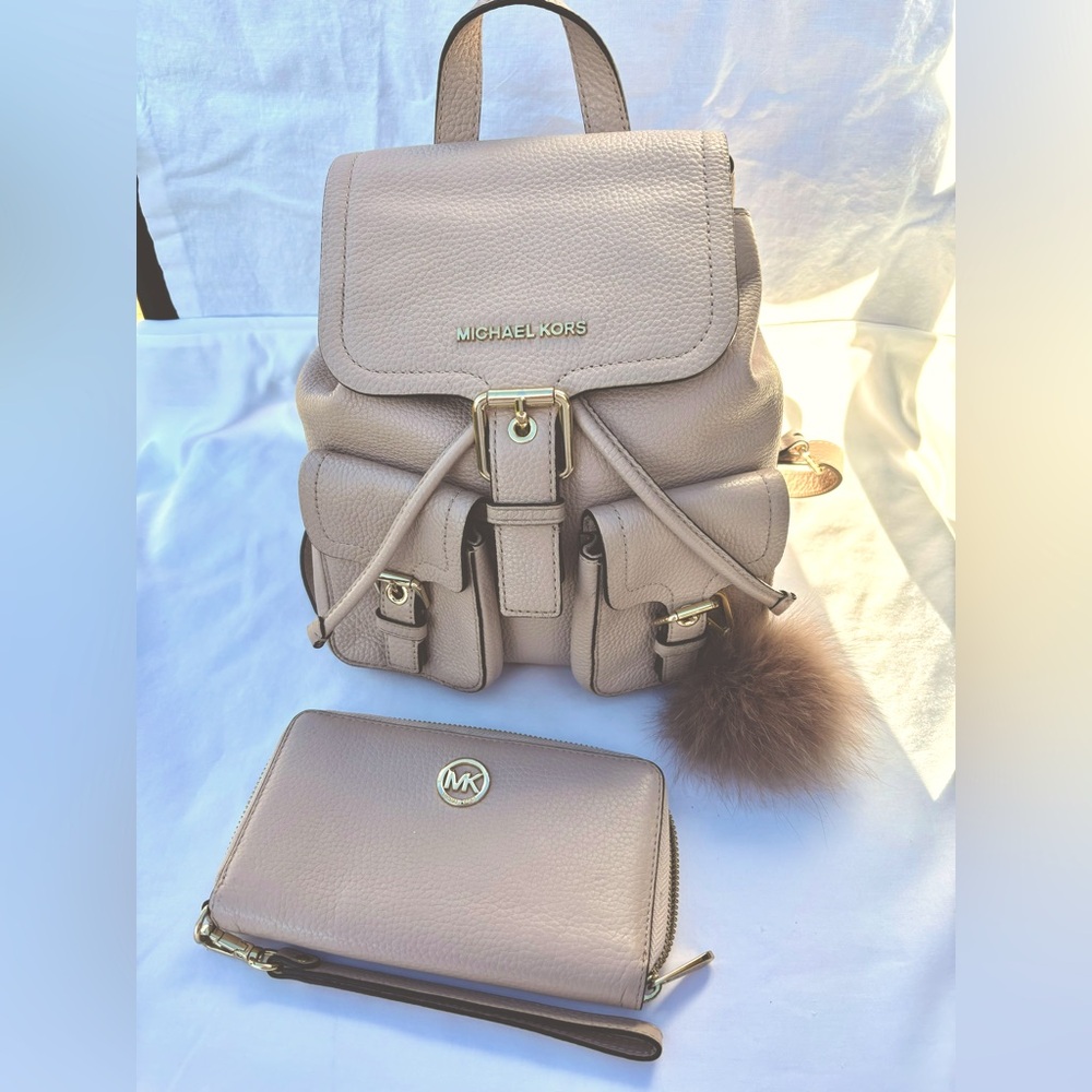 Michael Kors soft pink leather backpack, travel wallet, and fur keychain.